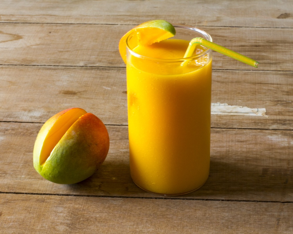 Fresh mango smoothie in a glass